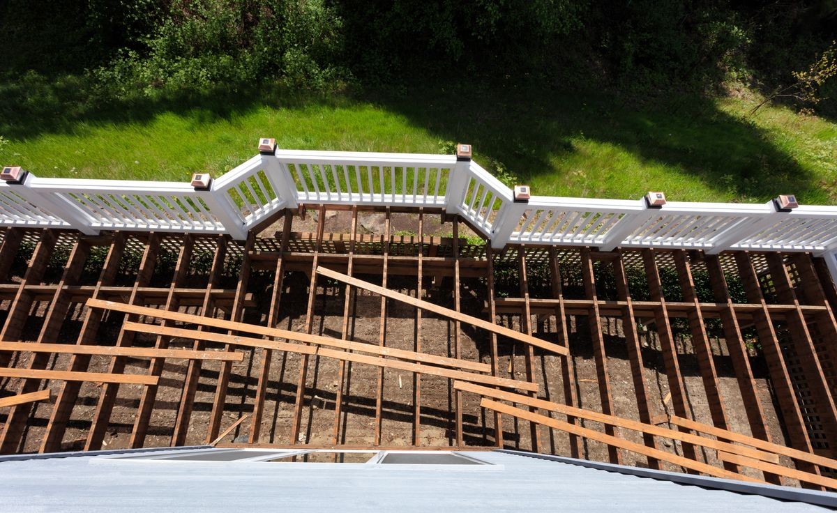 Overhead view of aged outdoor wooden cedar deck being tore down 